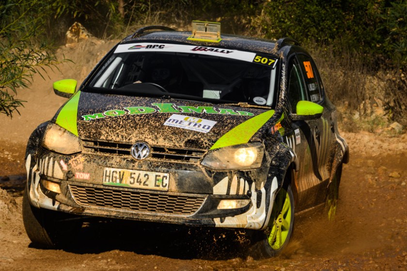 A Volkswagen Polo in action on gravel.